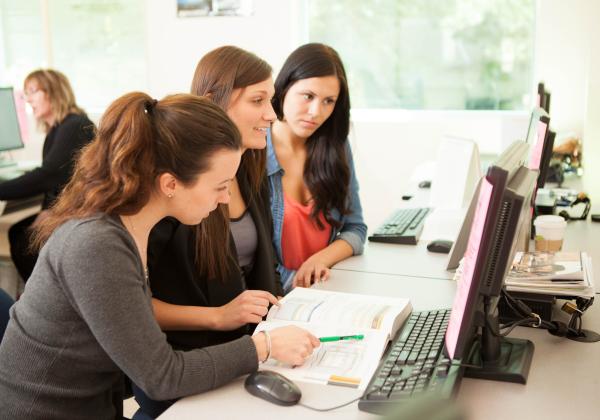 Legal Administrative Assistant and Accounting Assistant students of the Applied Business Technology conducting an online research together