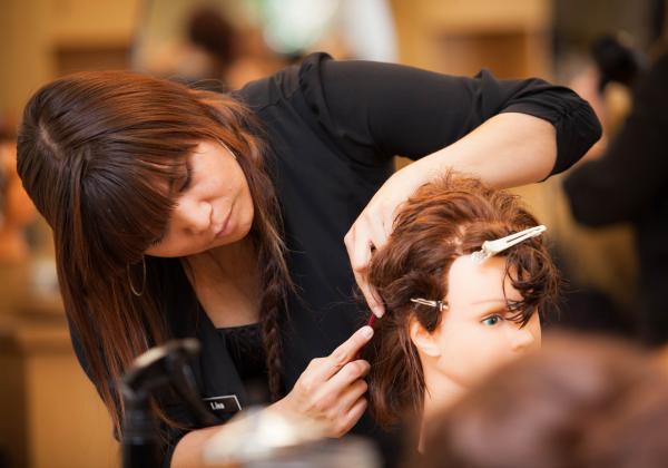 A Hair Stylist course student at VIU's hairdressing school