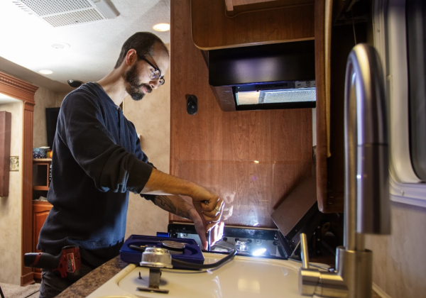 Man working inside a recreational vehicle